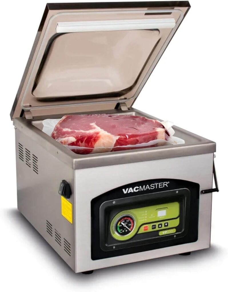 Envasadora al vacio industrial de cámara VacMaster VP230 con carne sellada al vacío en su interior.